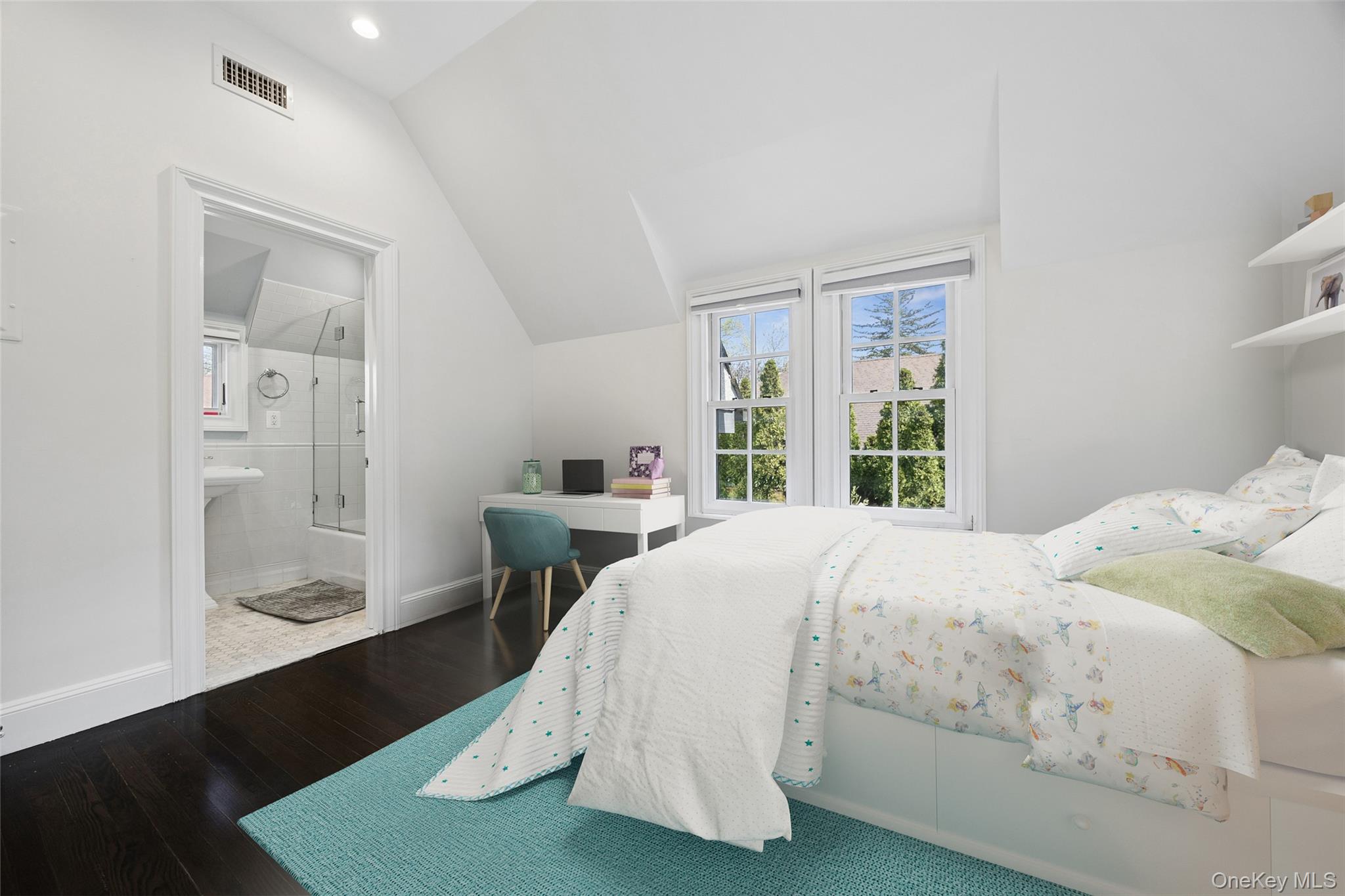 216 Beverly Road Queens, NY 11363 - Photo 11 of 50 a bed sitting in a bedroom next to a window