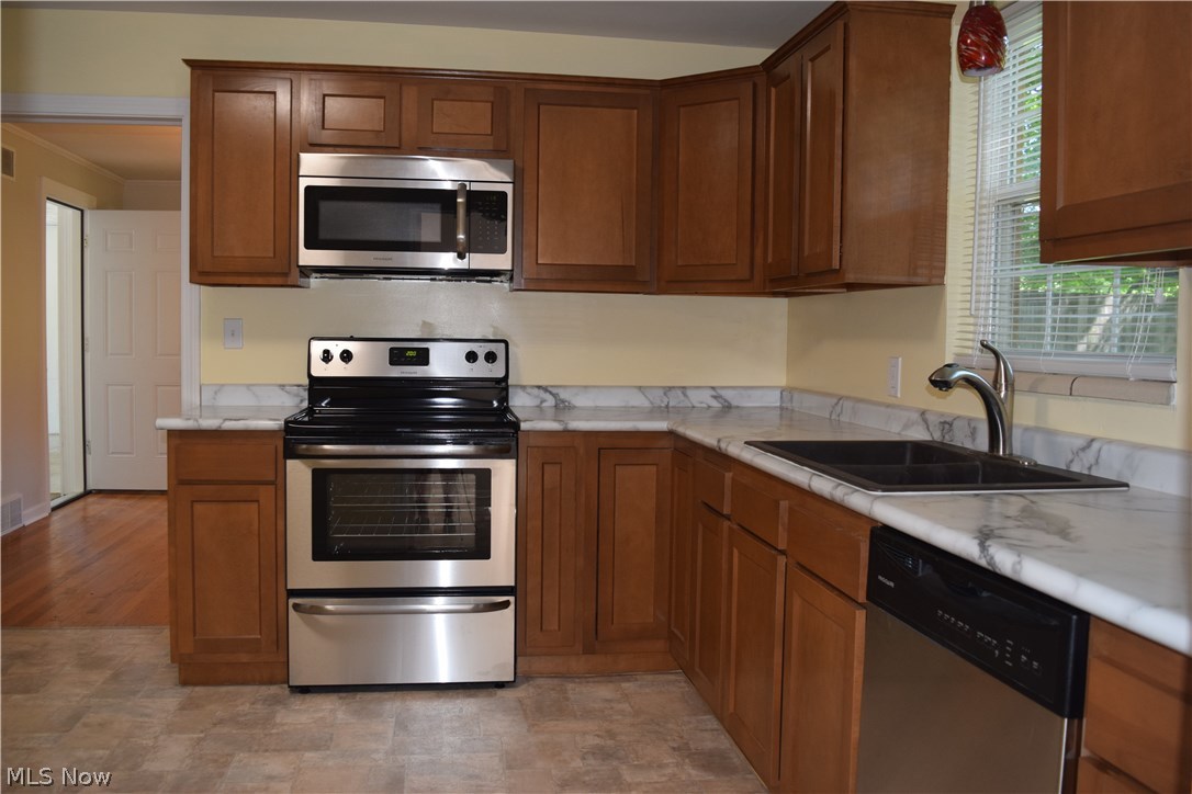 616 Everhard Road Southwest North Canton, OH 44709 - Photo 6 of 18 This all new kitchen offers tons of cabinet space, a lazy susan, stainless appliances, and double pantry cabinets.