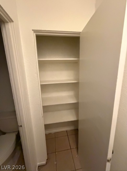 521 North Decatur Boulevard, Unit B Las Vegas, NV 89107 - Photo 11 of 17 Functional linen closet provides ample storage within a tiled space.