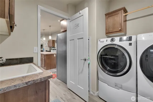 a kitchen with a refrigerator a sink and dishwasher