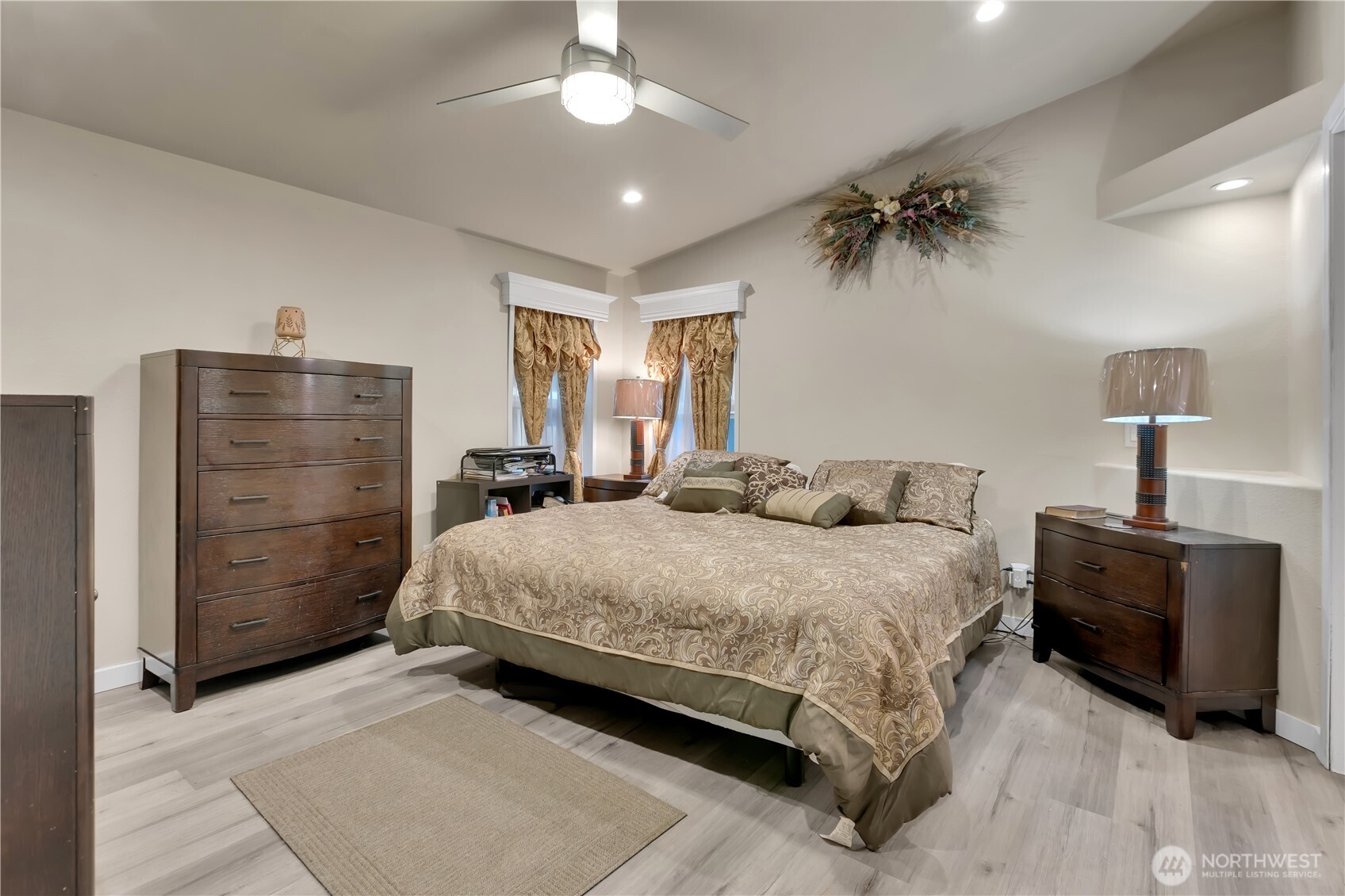 439 Duterrow Road Southeast, Unit 14 Olympia, WA 98513 - Photo 12 of 25 a bedroom with a bed and a chandelier