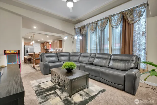a living room with furniture and a large window