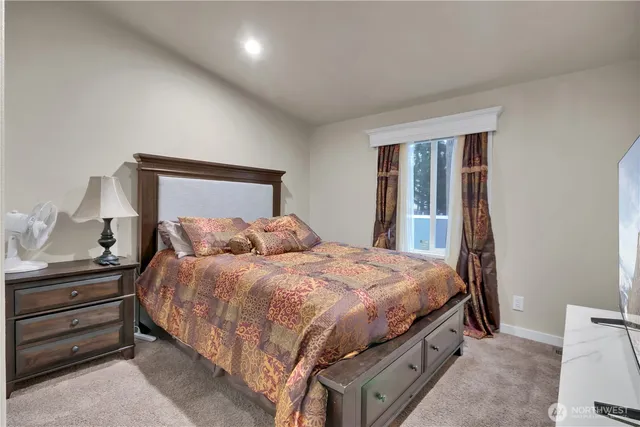 a bedroom with a bed and a dresser