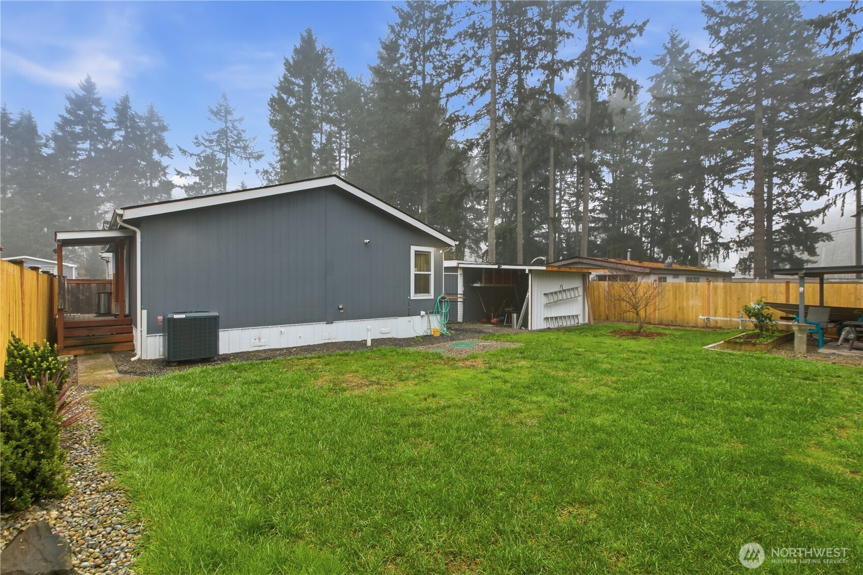 439 Duterrow Road Southeast, Unit 14 Olympia, WA 98513 - Photo 24 of 25 a backyard of a house with lots of green space