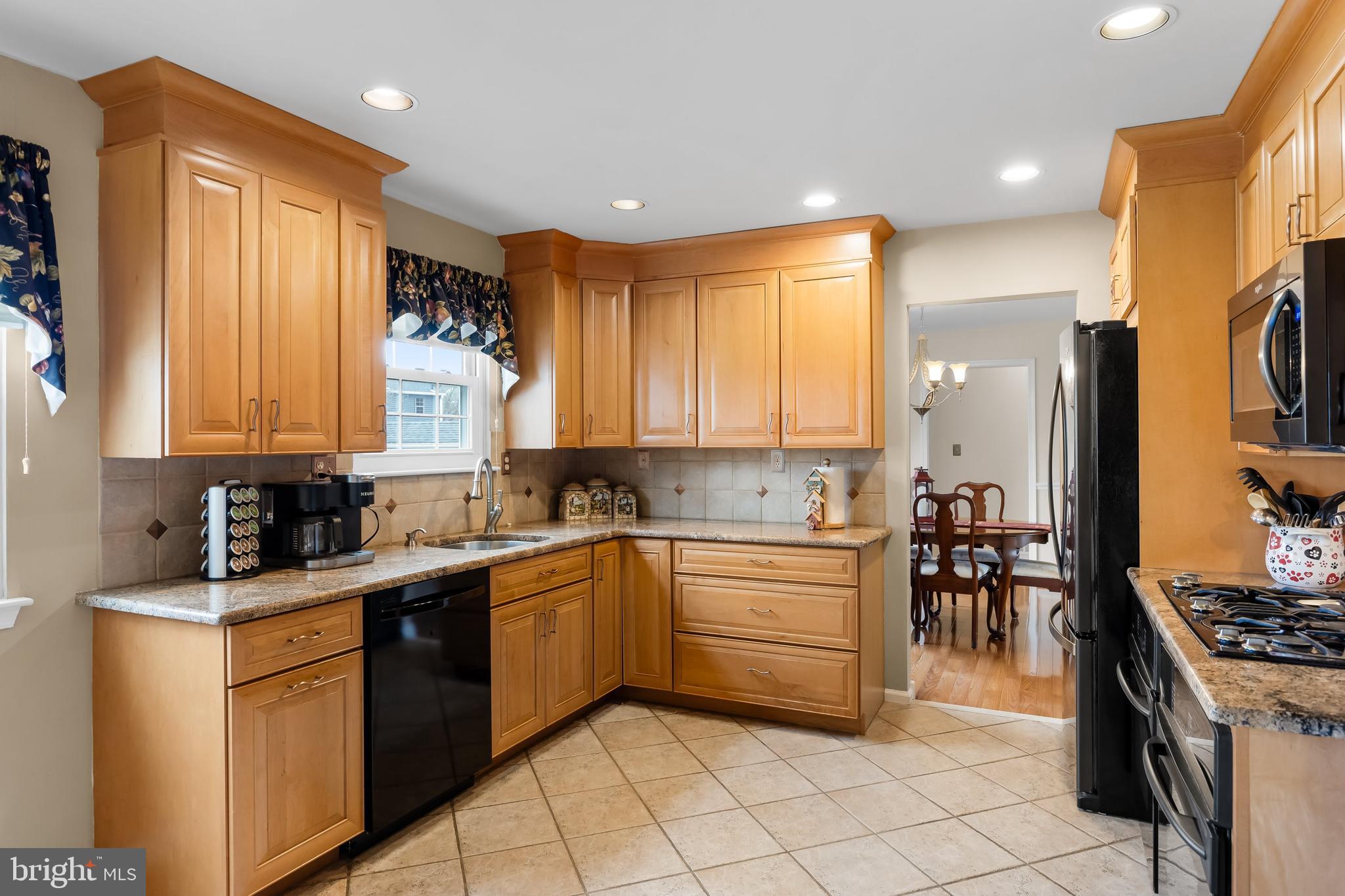 4 Utica Road Marlton, NJ 08053 - Photo 11 of 42 a kitchen with a sink stove and cabinets