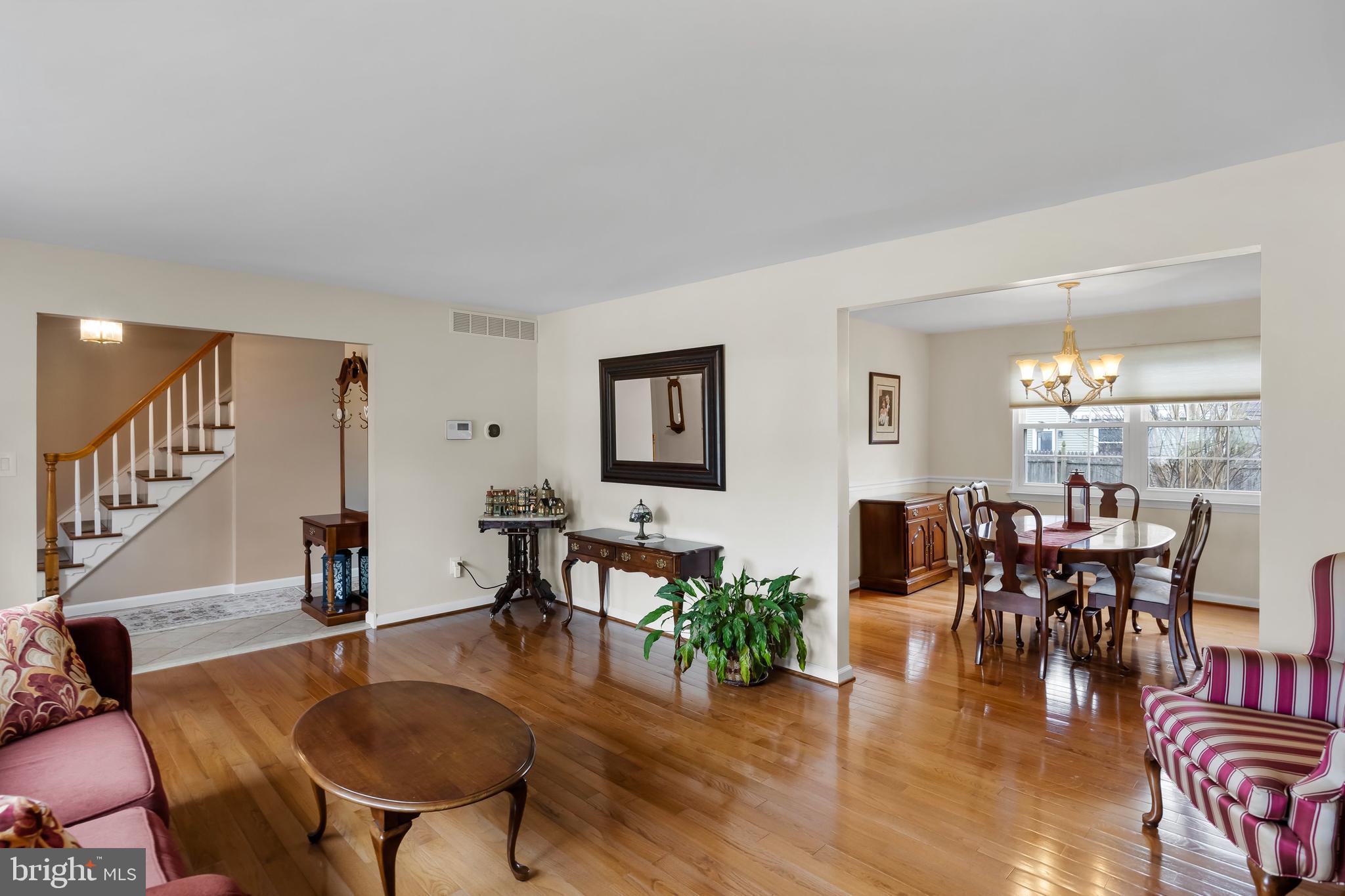 4 Utica Road Marlton, NJ 08053 - Photo 8 of 42 a living room with furniture dining table and wooden floor