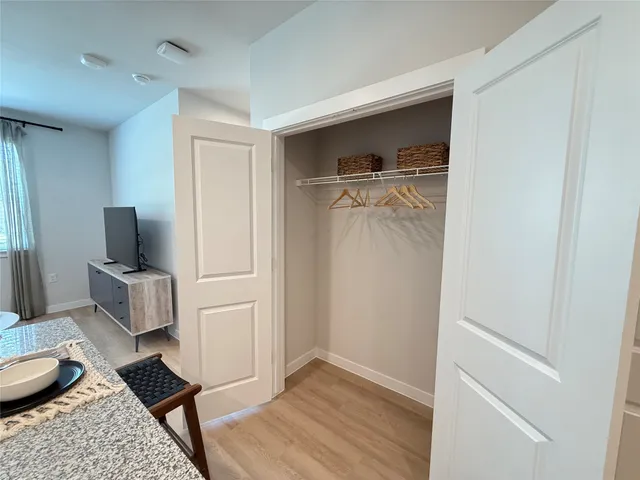 a room with a chair and wooden floor
