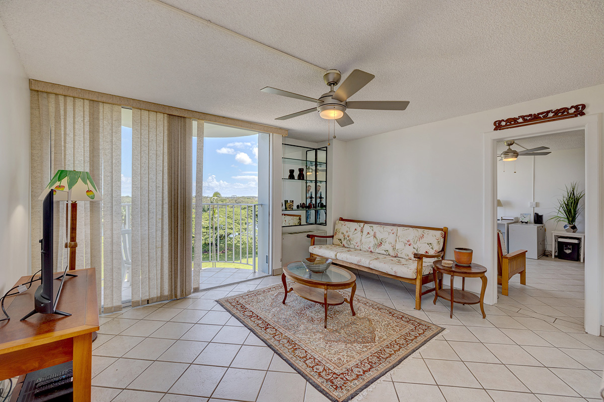 101 Aupuni Street, Unit 802 Hilo, HI 96720 - Photo 15 of 29 a living room with furniture a ceiling fan and a window