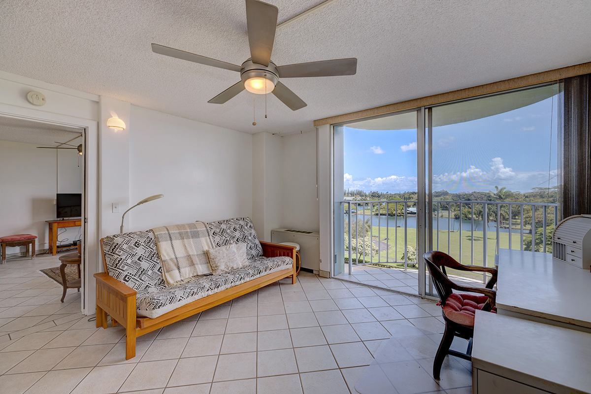 101 Aupuni Street, Unit 802 Hilo, HI 96720 - Photo 16 of 29 a bedroom with a bed and large windows