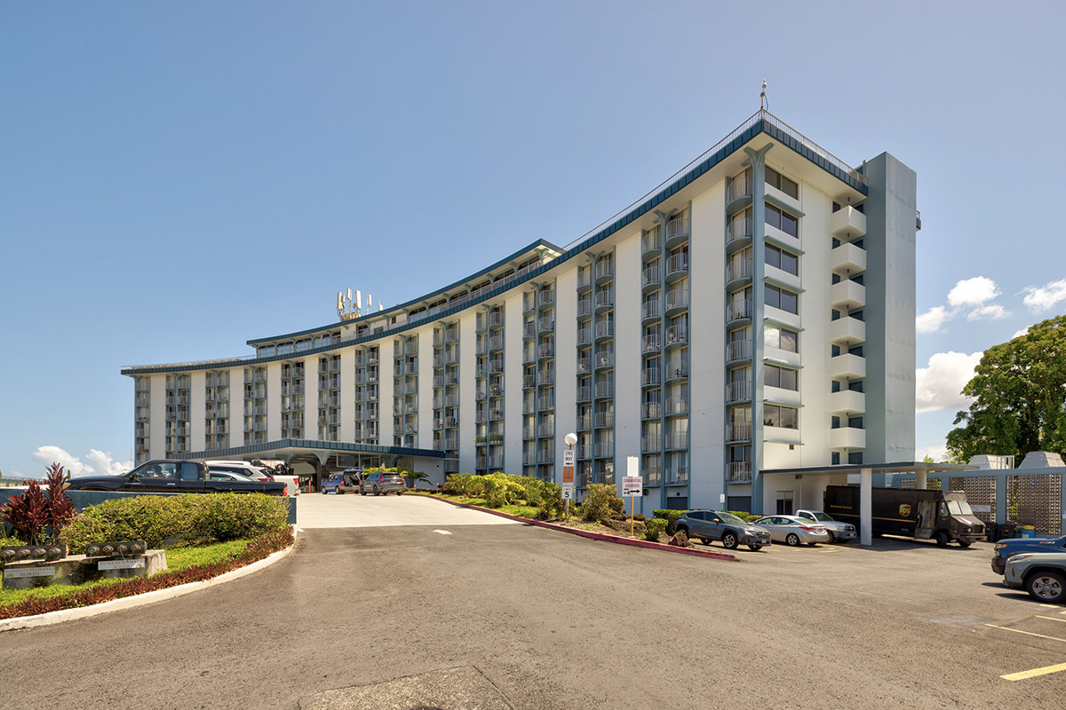 101 Aupuni Street, Unit 802 Hilo, HI 96720 - Photo 28 of 29 a view of a blue and white building in front of a house