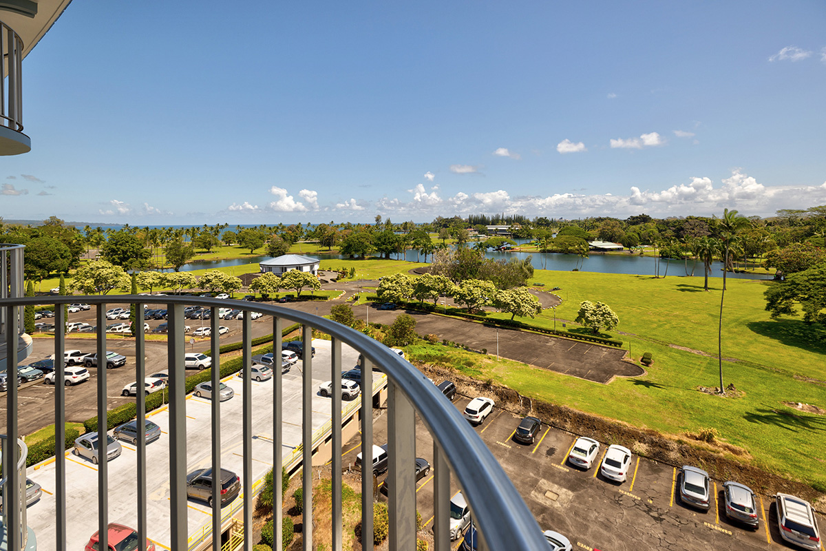 101 Aupuni Street, Unit 802 Hilo, HI 96720 - Photo 7 of 29 a view of swimming pool with outdoor seating and ocean view