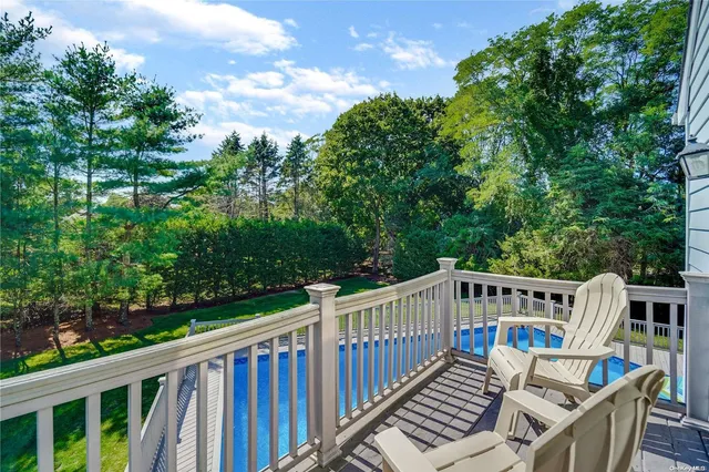 a view of a roof deck with furniture