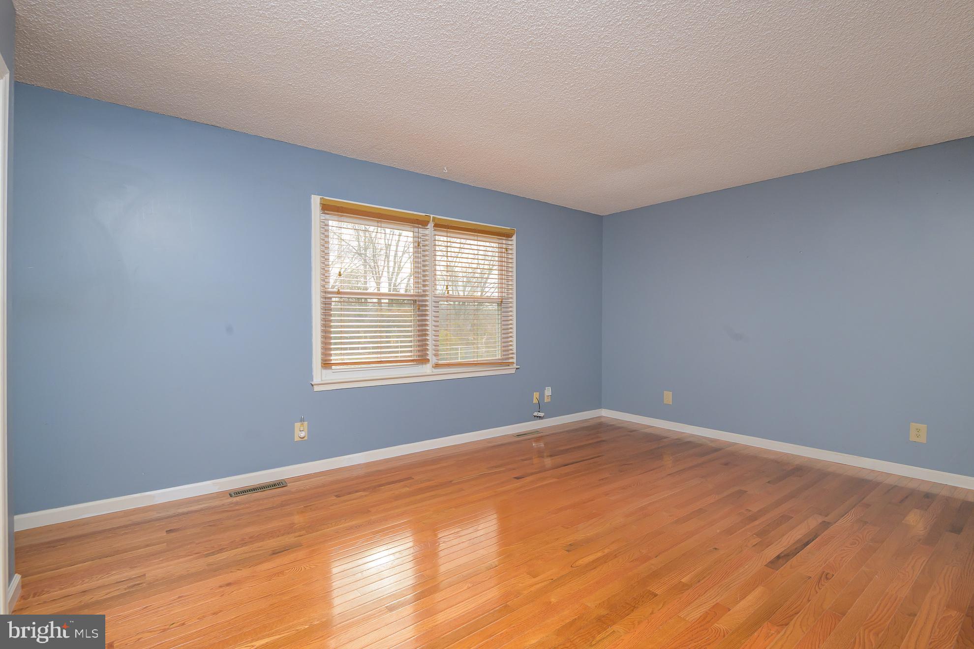50 Olde Concord Road Stafford, VA 22554 - Photo 16 of 41 a view of an empty room with wooden floor and a window