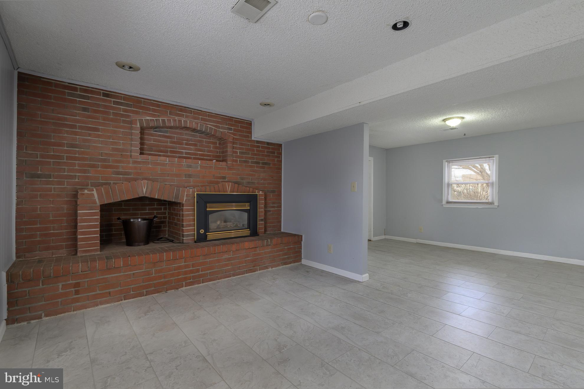 50 Olde Concord Road Stafford, VA 22554 - Photo 29 of 41 an empty room with windows and fireplace