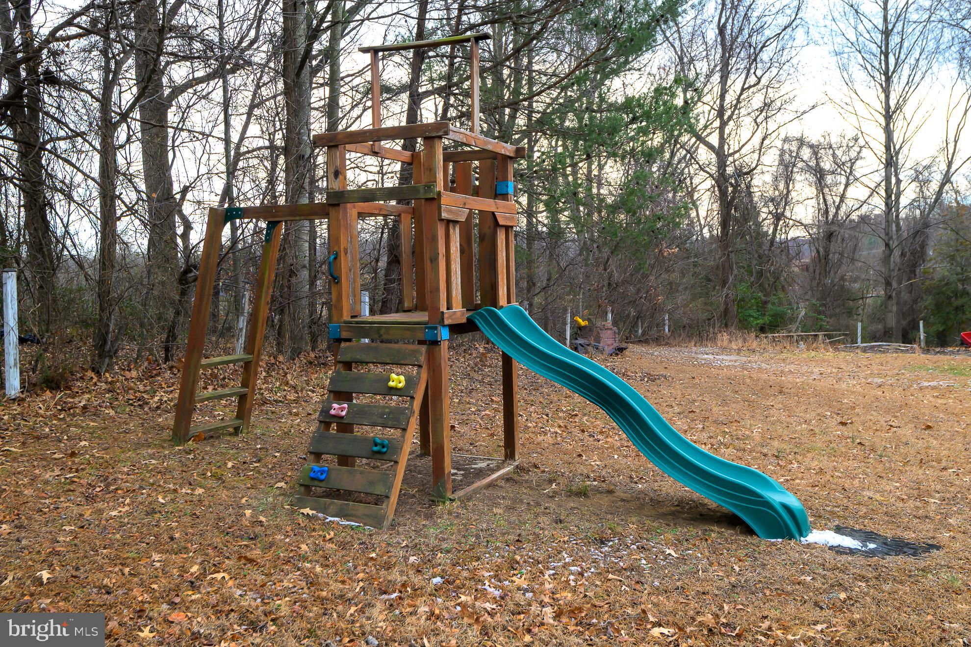 50 Olde Concord Road Stafford, VA 22554 - Photo 35 of 41 Playground adventure awaits in nature's embrace.