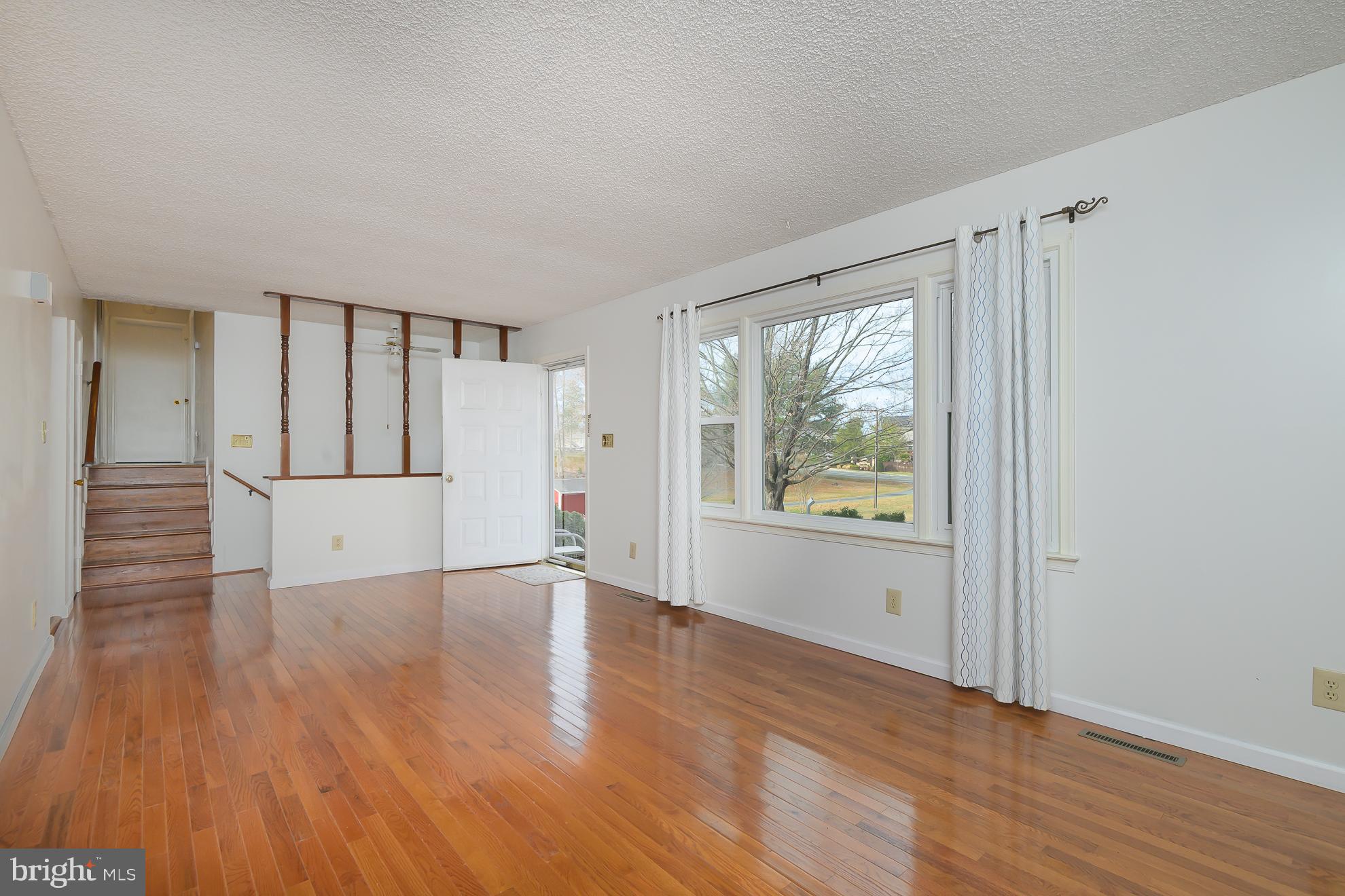 50 Olde Concord Road Stafford, VA 22554 - Photo 5 of 41 a view of an empty room with wooden floor and a window