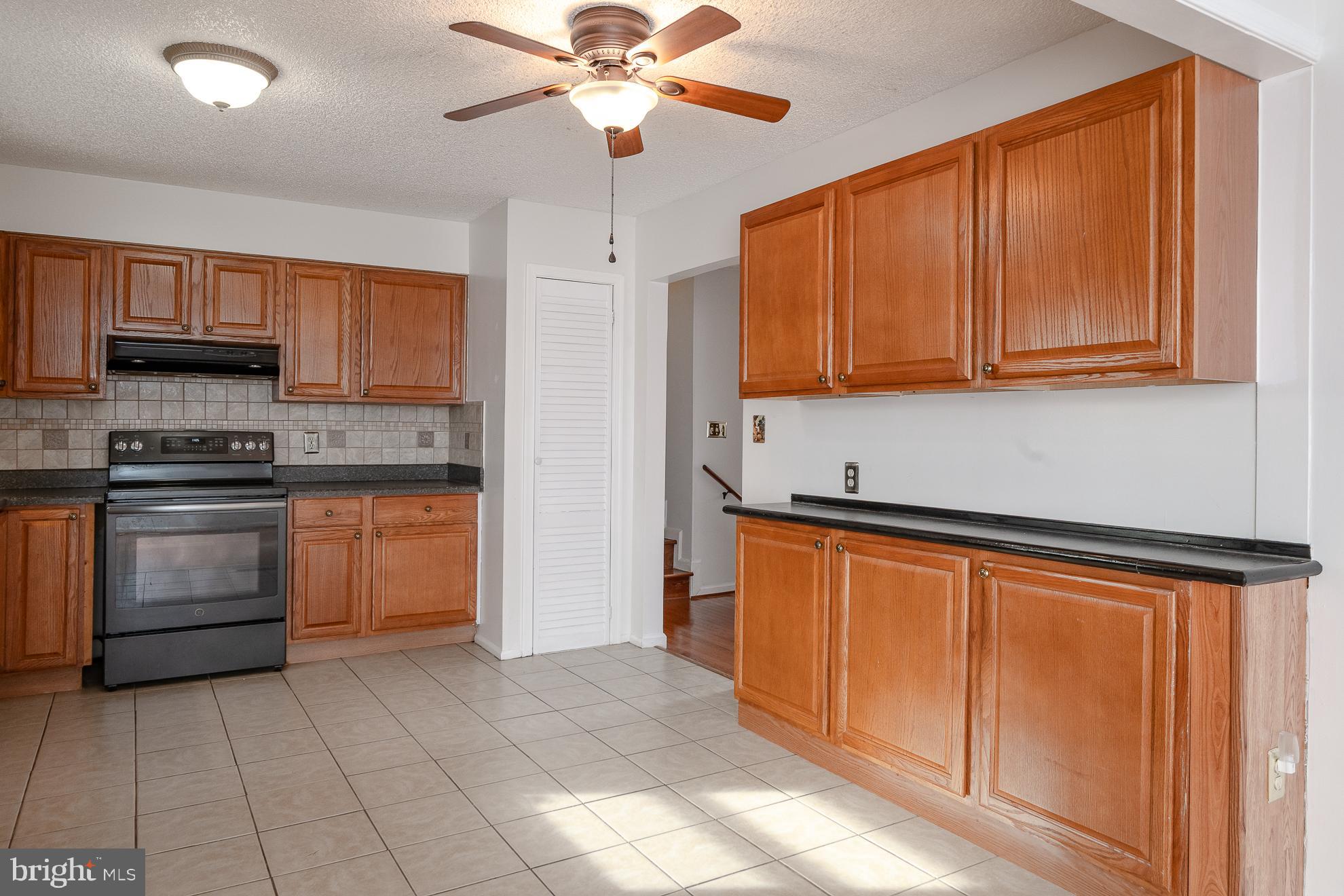 50 Olde Concord Road Stafford, VA 22554 - Photo 9 of 41 Spacious kitchen with warm wooden cabinetry.