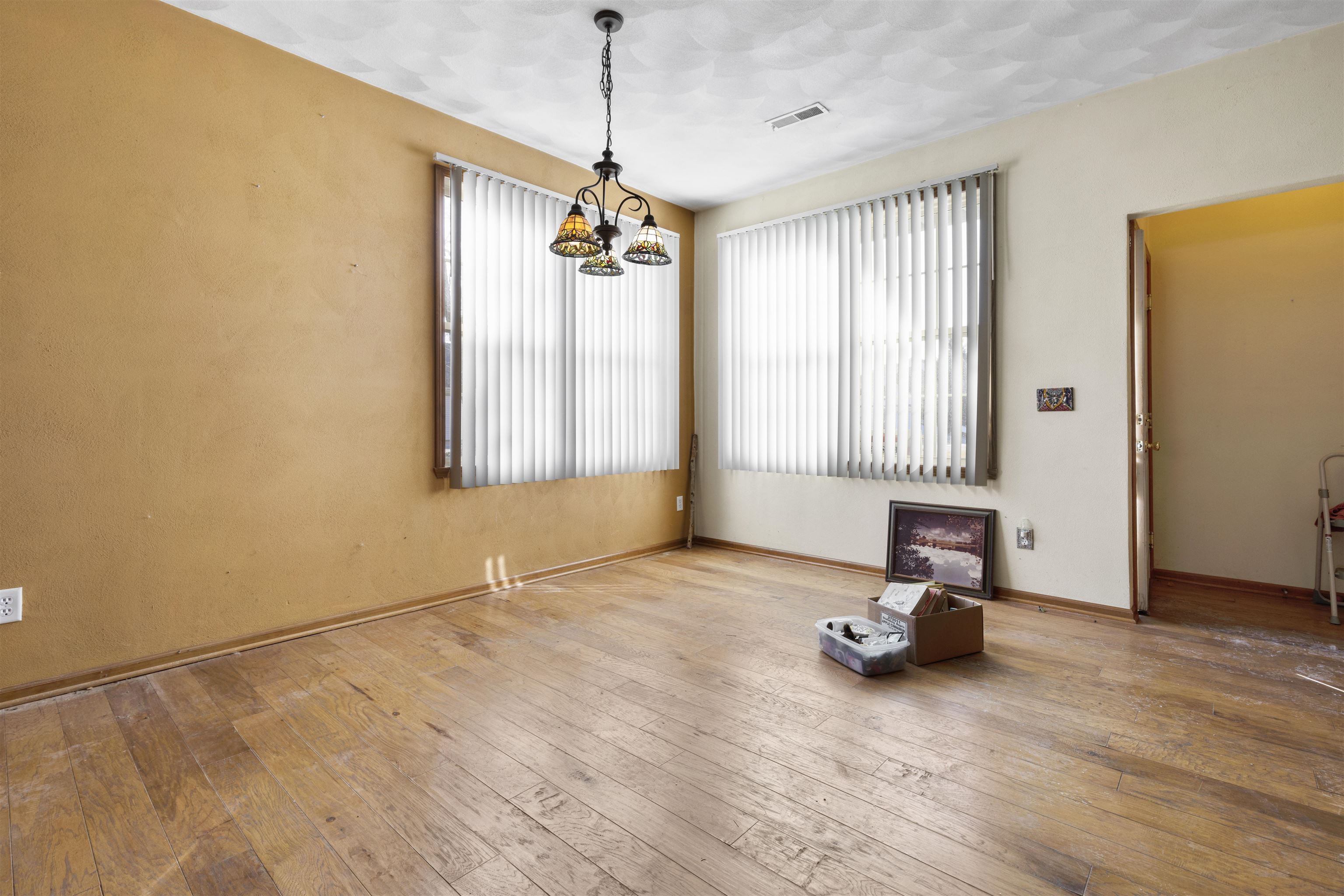 10149 Monarch Road, Unit 3 Roscoe, IL 61073 - Photo 3 of 13 a view of a room with window wooden floor and a chandelier