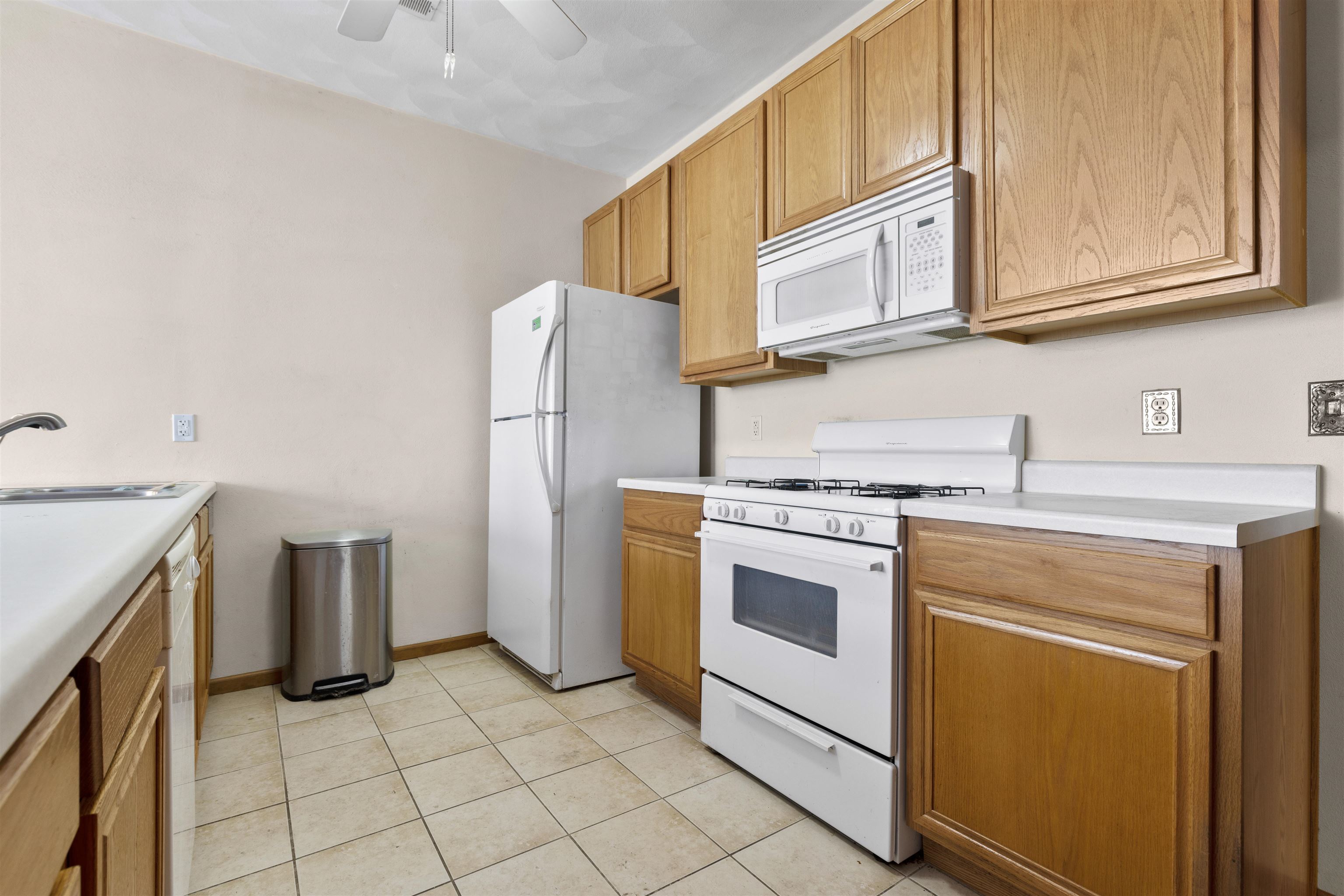 10149 Monarch Road, Unit 3 Roscoe, IL 61073 - Photo 6 of 13 a kitchen with stainless steel appliances granite countertop a refrigerator and a stove top oven