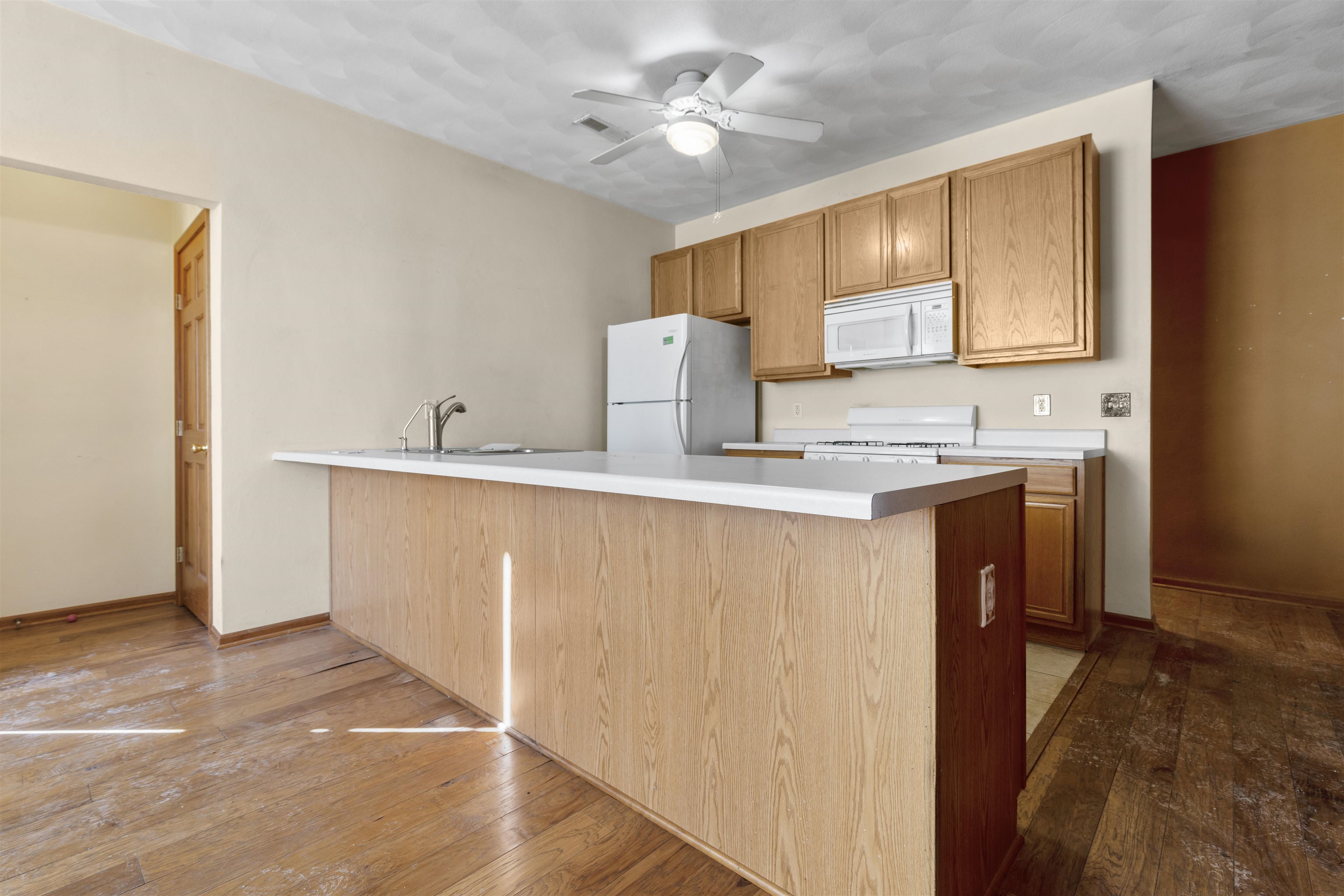 10149 Monarch Road, Unit 3 Roscoe, IL 61073 - Photo 7 of 13 a kitchen with a sink a cabinets and window