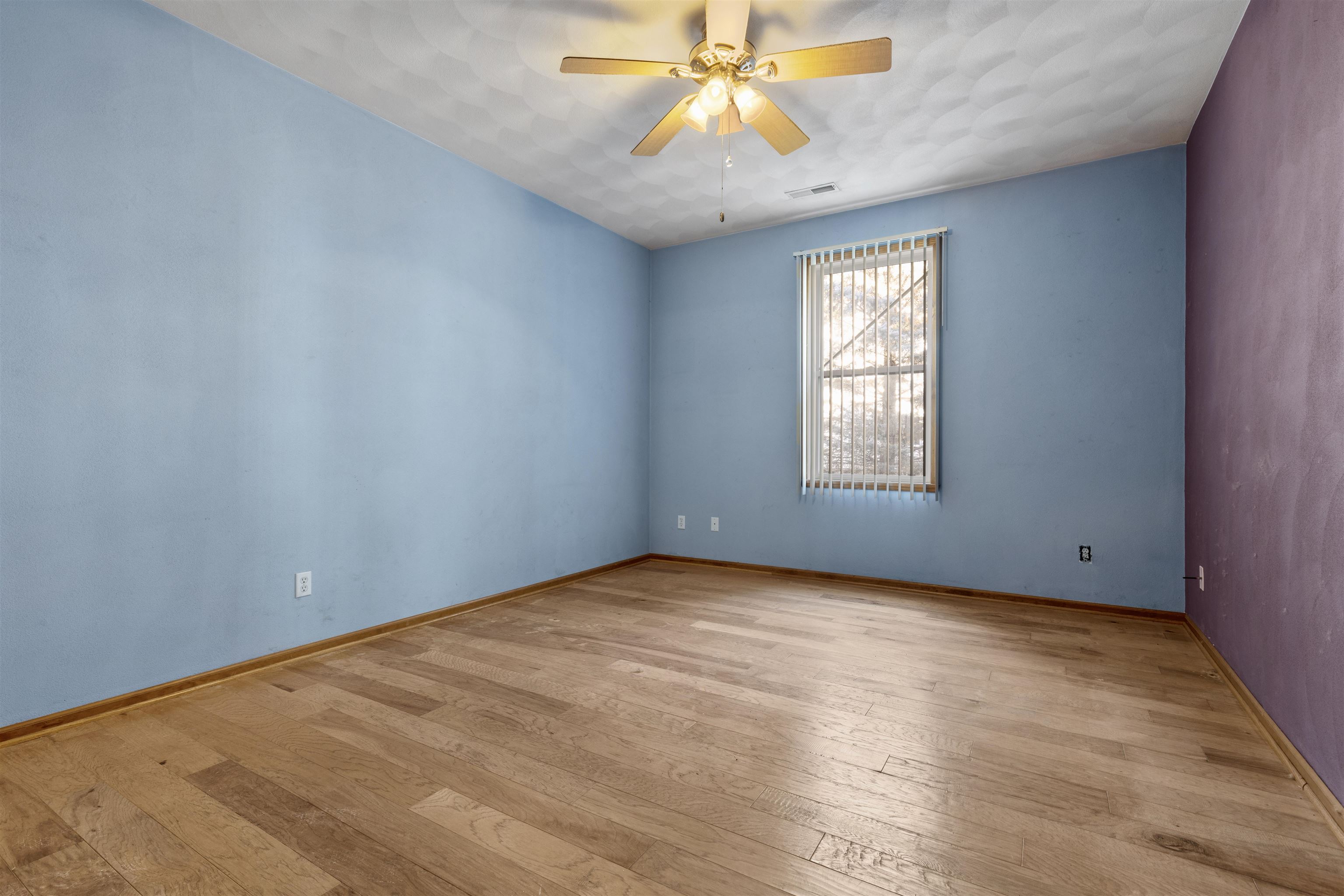 10149 Monarch Road, Unit 3 Roscoe, IL 61073 - Photo 9 of 13 wooden floor in an empty room with a window