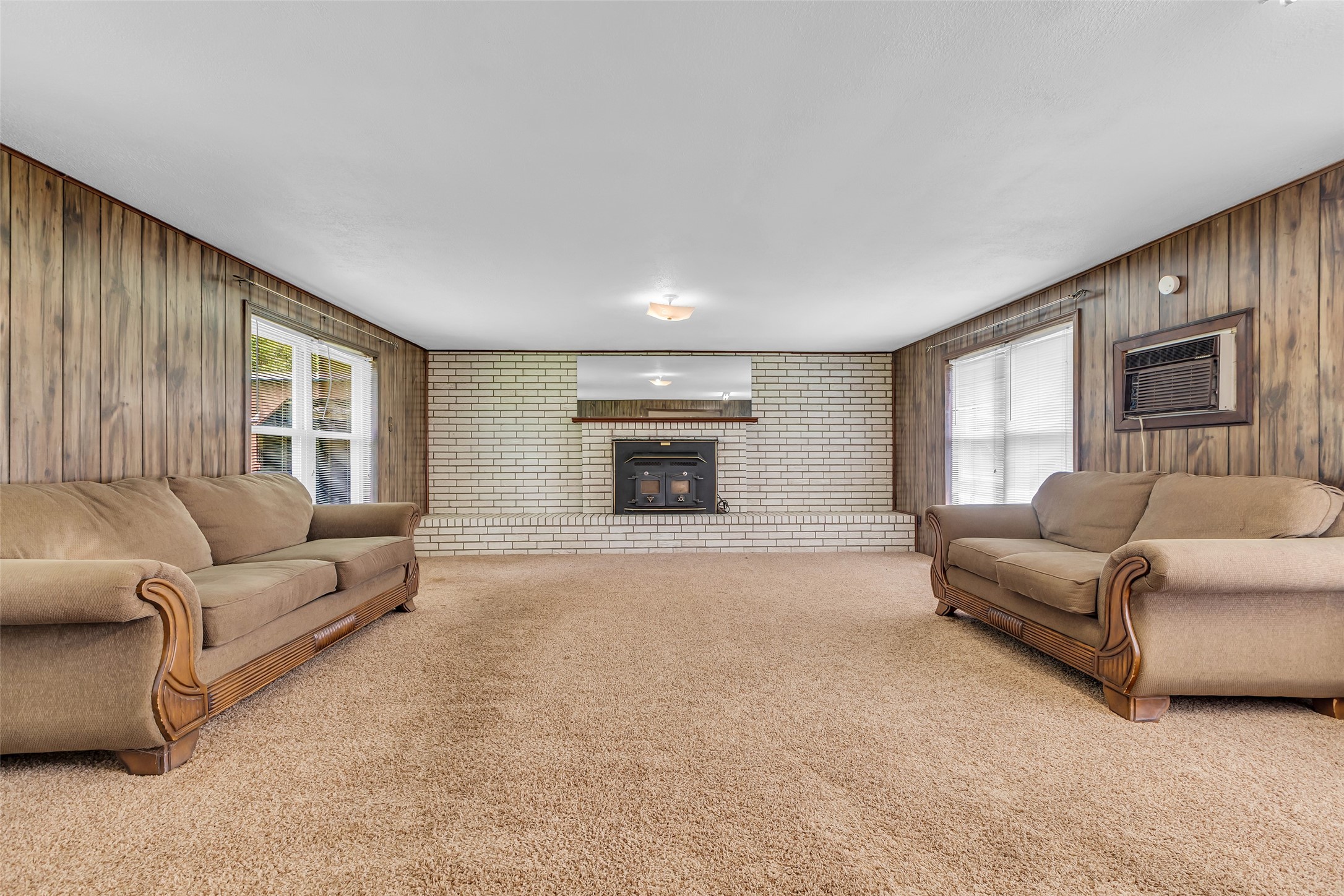 302 Channelview Drive Anahuac, TX 77514 - Photo 19 of 35 a living room with furniture and a fireplace