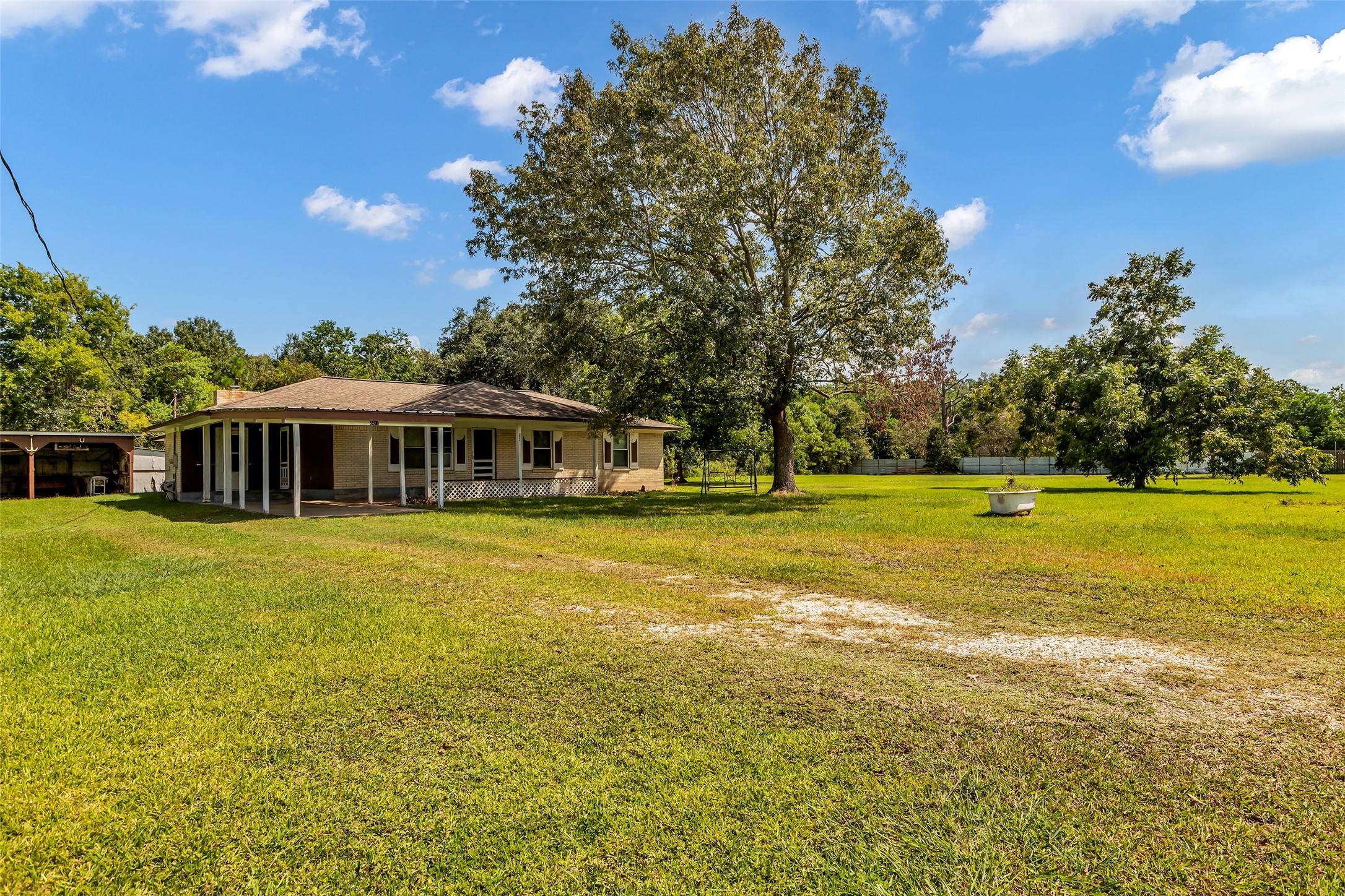 302 Channelview Drive Anahuac, TX 77514 - Photo 2 of 35 a front view of a house with a big yard
