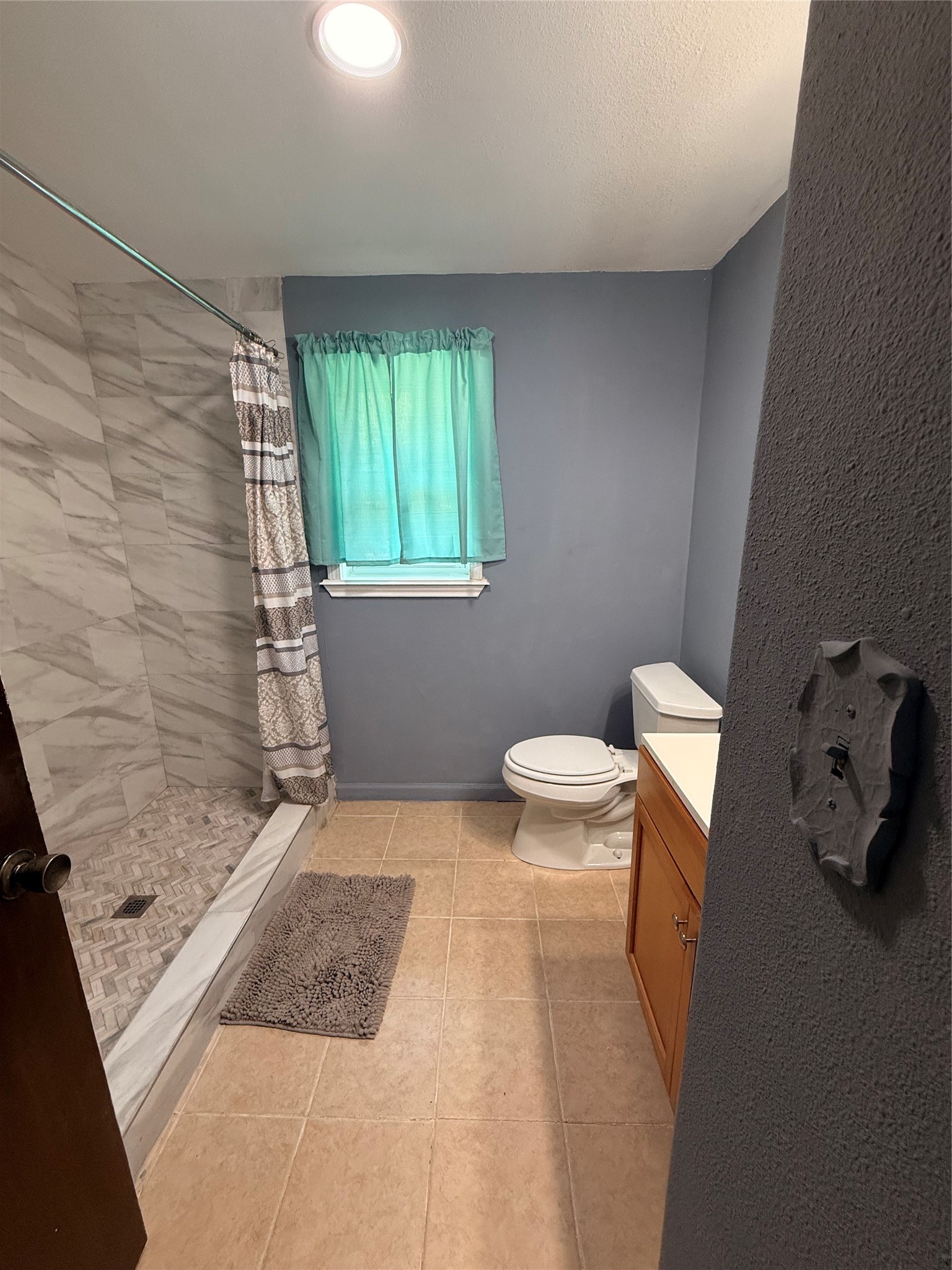 302 Channelview Drive Anahuac, TX 77514 - Photo 23 of 35 a bathroom with a toilet and a shower