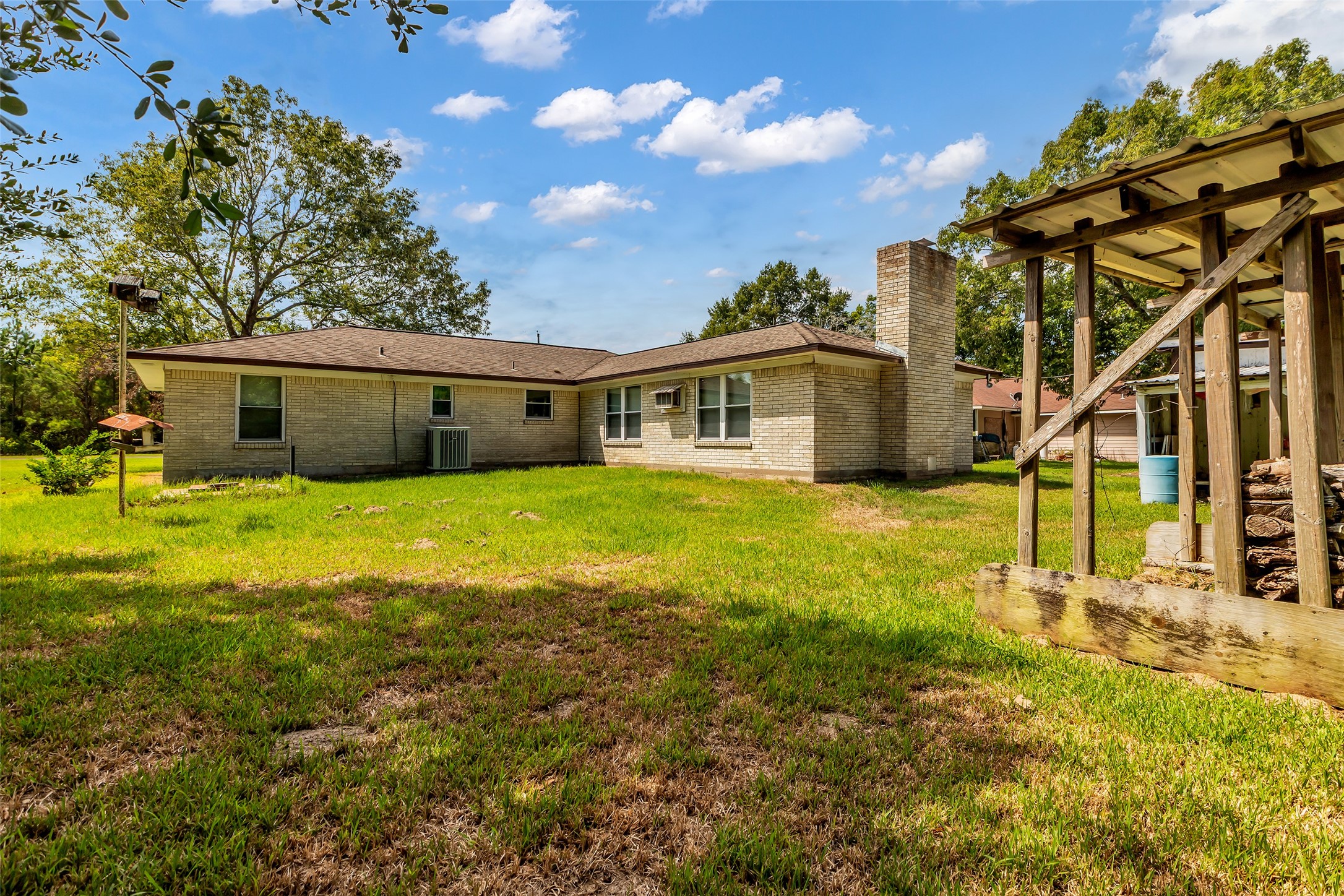 302 Channelview Drive Anahuac, TX 77514 - Photo 30 of 35 a view of a house with a yard