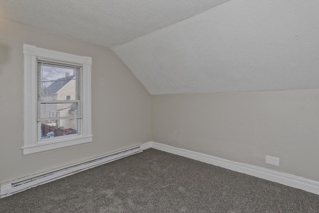 81 Hayden Avenue Springfield, MA 01109 - Photo 20 of 34 an empty room with a window