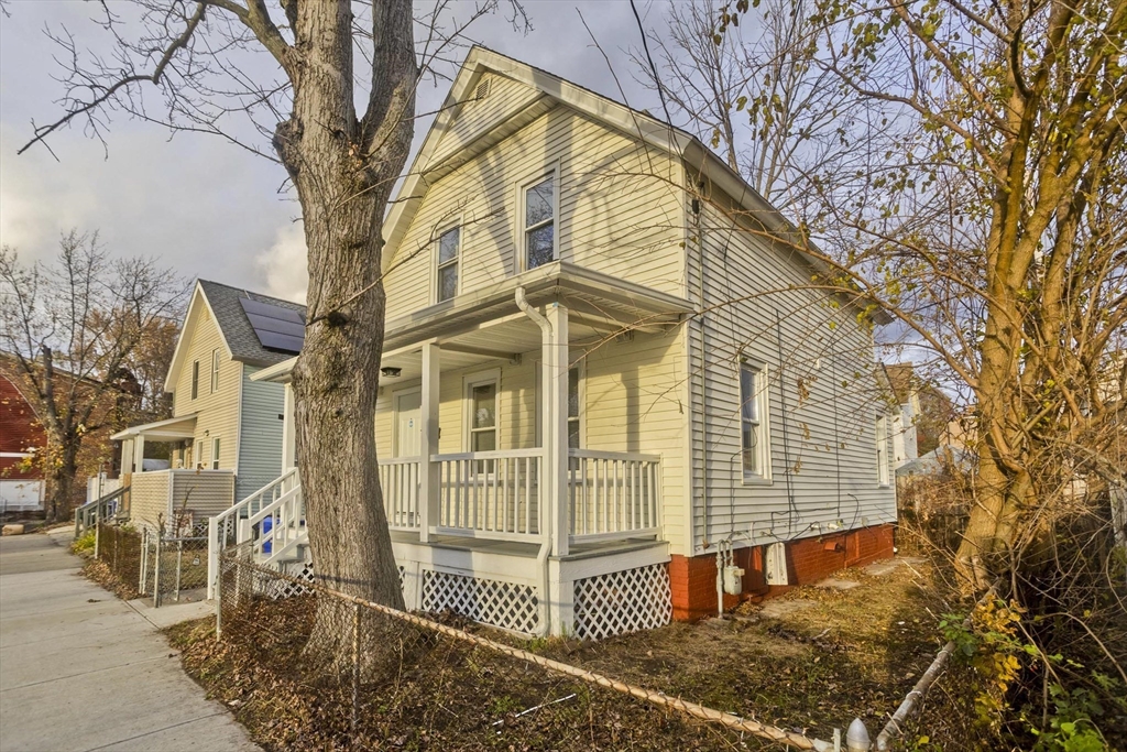 81 Hayden Avenue Springfield, MA 01109 - Photo 2 of 34 front view of a house with a large tree