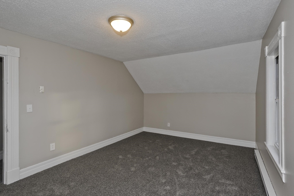 81 Hayden Avenue Springfield, MA 01109 - Photo 25 of 34 an empty room with a empty space and window
