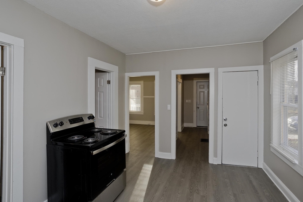 81 Hayden Avenue Springfield, MA 01109 - Photo 8 of 34 a view of a hallway with wooden floor and closet