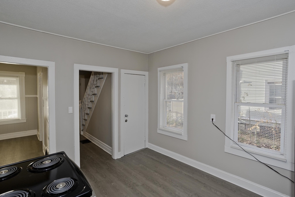 81 Hayden Avenue Springfield, MA 01109 - Photo 9 of 34 a view of a livingroom with wooden floor and a window