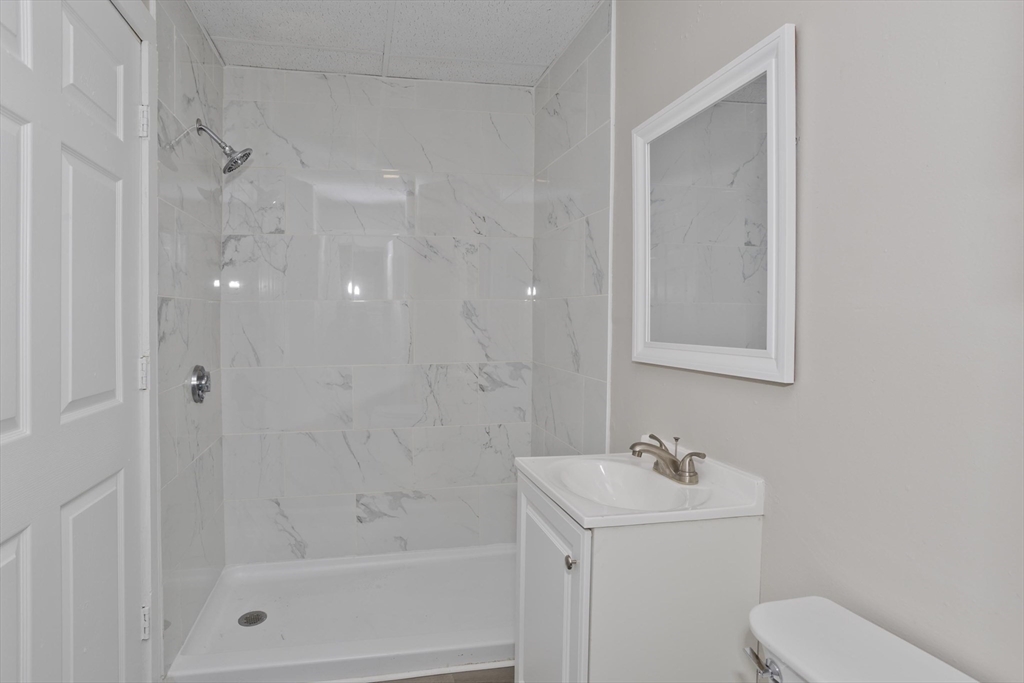 81 Hayden Avenue Springfield, MA 01109 - Photo 10 of 34 a bathroom with a shower a toilet and sink
