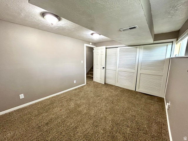 441 South 400 East Payson, UT 84651 - Photo 26 of 39 Carpeted room featuring neutral wall paint, white trim, recessed lighting, and a white louvered bifold closet door
