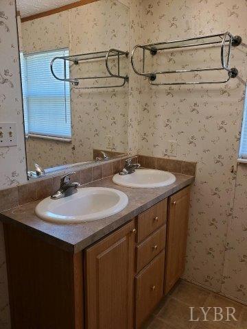 2075 New Bethel Road Meherrin, VA 23954 - Photo 14 of 32 a bathroom with a sink and a mirror