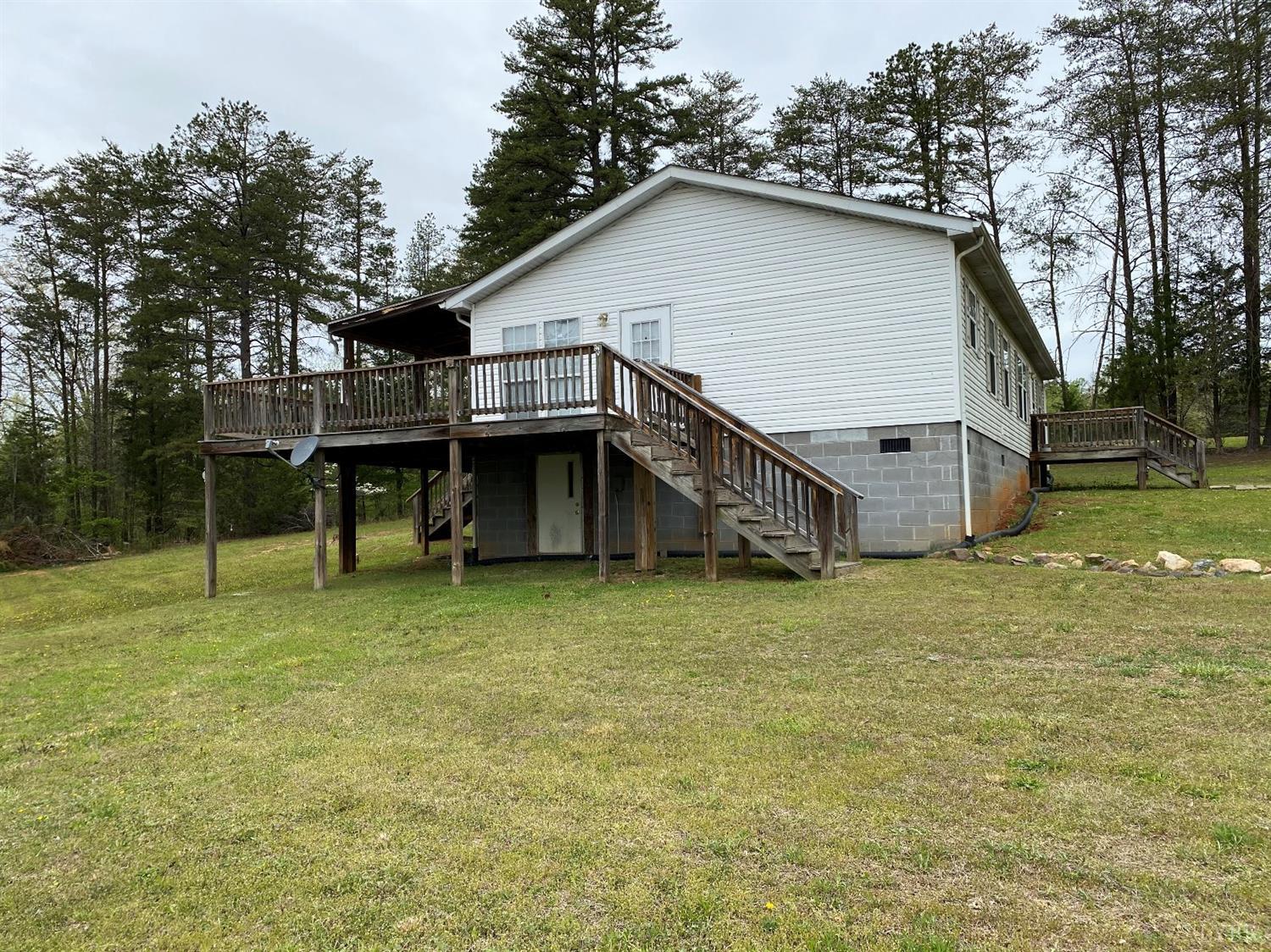 2075 New Bethel Road Meherrin, VA 23954 - Photo 25 of 32 a view of a house with a yard and wooden fence