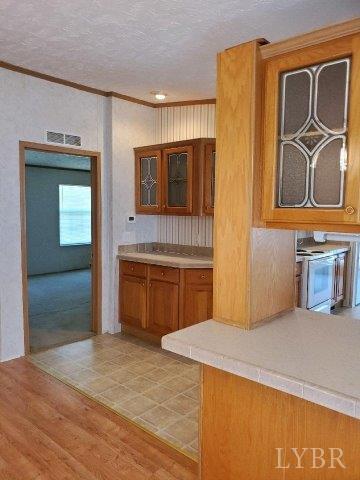 2075 New Bethel Road Meherrin, VA 23954 - Photo 5 of 32 a kitchen with stainless steel appliances a stove and a refrigerator
