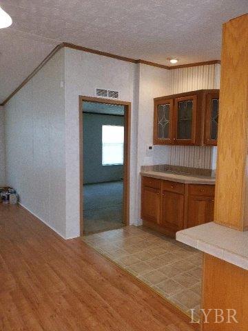 2075 New Bethel Road Meherrin, VA 23954 - Photo 6 of 32 a kitchen with a sink and a refrigerator