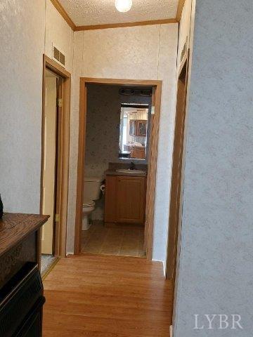 2075 New Bethel Road Meherrin, VA 23954 - Photo 8 of 32 a view of a kitchen from a hallway