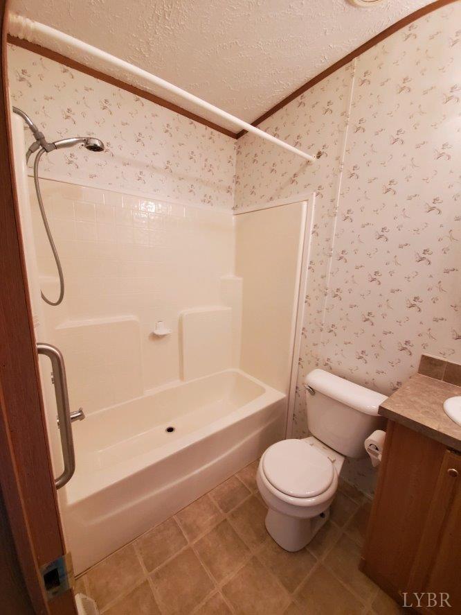 2075 New Bethel Road Meherrin, VA 23954 - Photo 9 of 32 a bathroom with a toilet and a shower