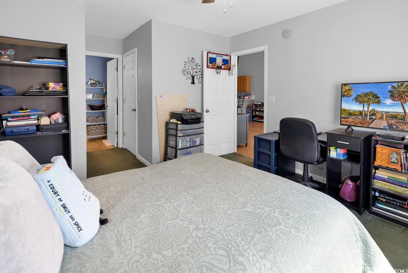 9450 Leeds Circle Myrtle Beach, SC 29588 - Photo 13 of 25 Bedroom with ceiling fan and carpet floors