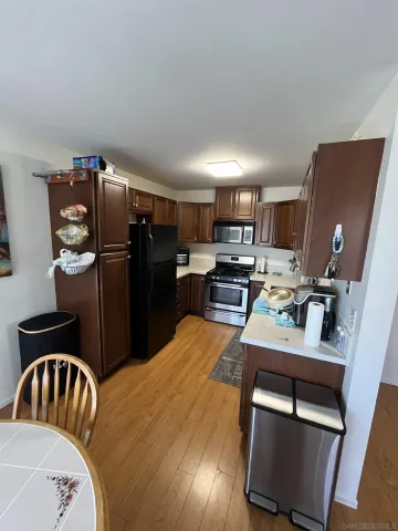 a kitchen with refrigerator and window