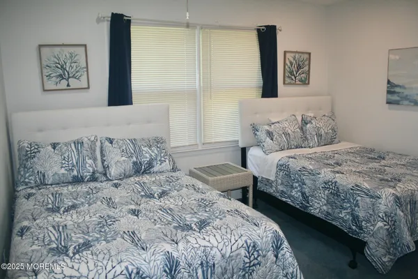 a bedroom with a large bed and a couch