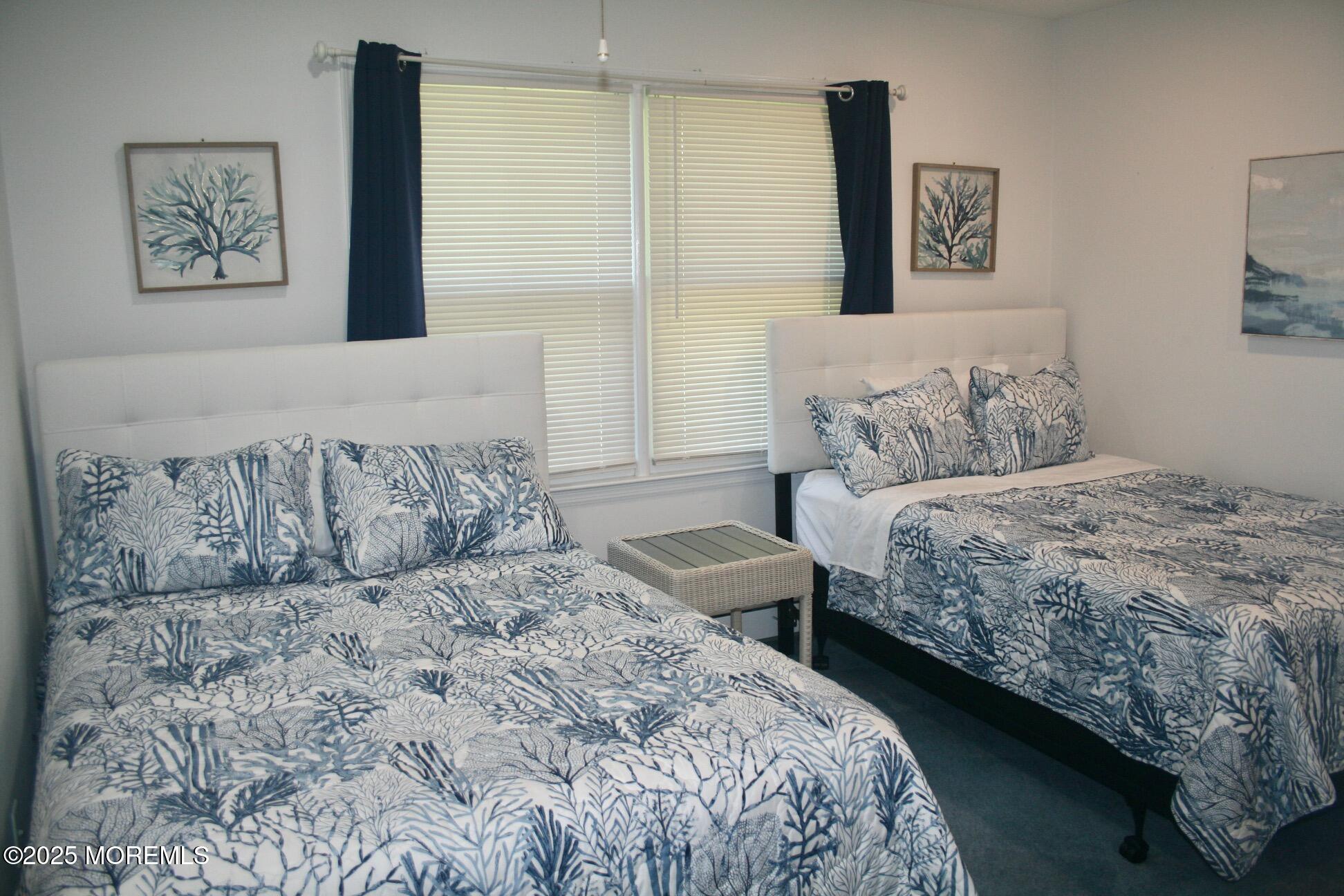 1812 Beverly Avenue Spring Lake Heights, NJ 07762 - Photo 11 of 18 a bedroom with a large bed and a couch