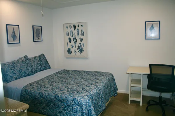 a bedroom with a bed and chair