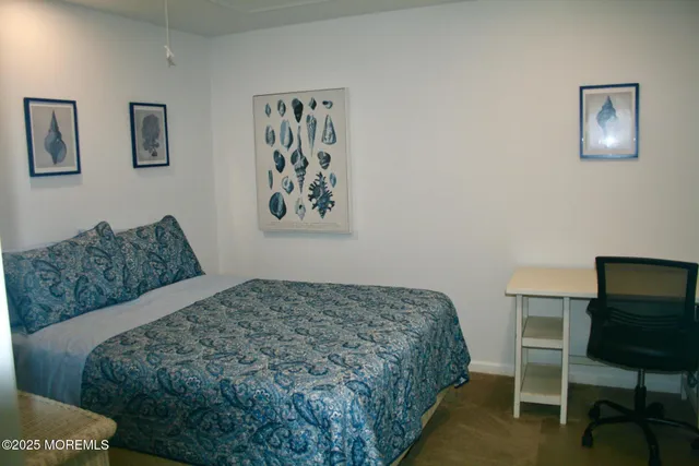 a bedroom with a bed and chair