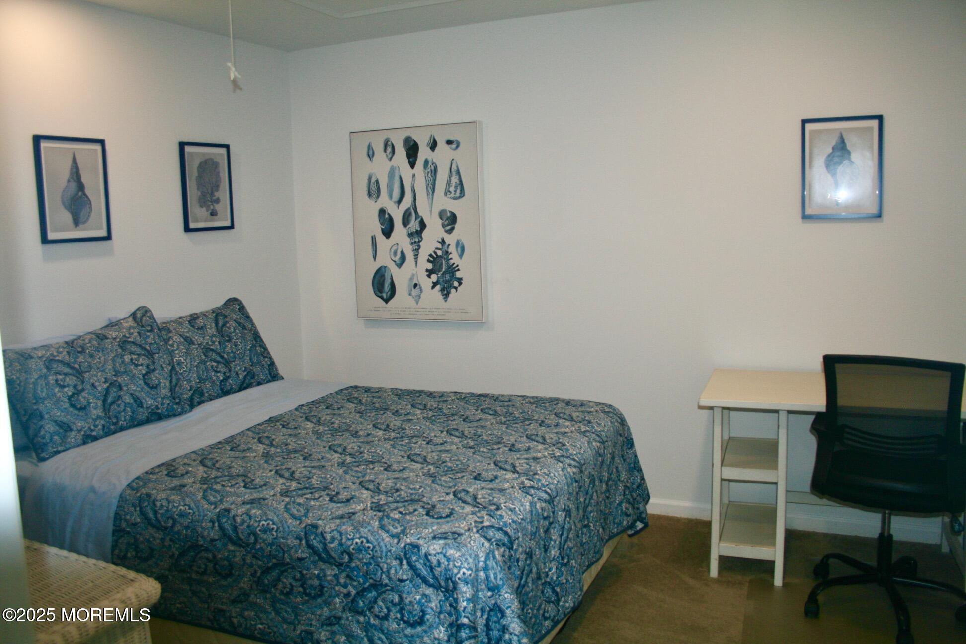 1812 Beverly Avenue Spring Lake Heights, NJ 07762 - Photo 12 of 18 a bedroom with a bed and chair