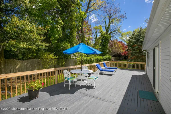 swimming pool view with a seating space